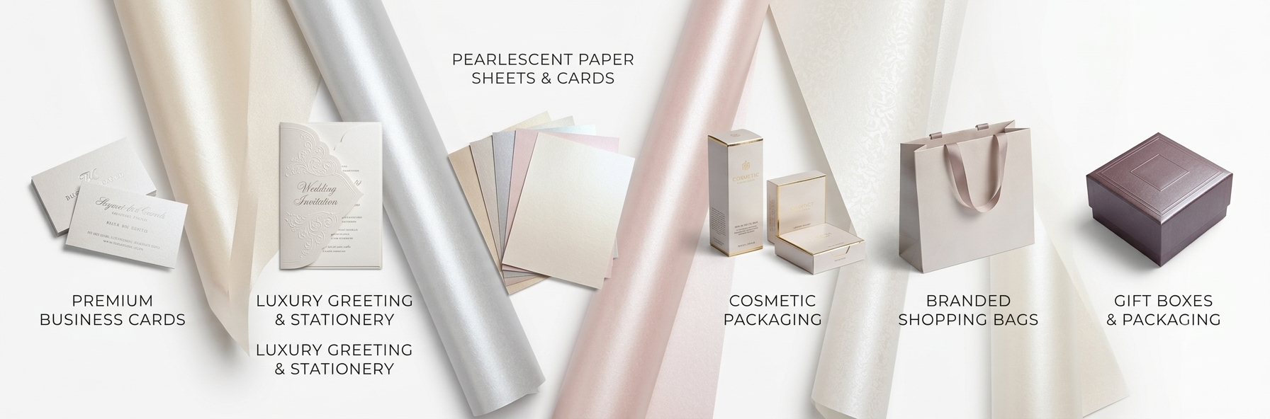 A comprehensive product display banner featuring various paper finishes and premium branded applications, showcasing specific categories including 'PREMIUM BUSINESS CARDS,' 'LUXURY GREETING & STATIONERY,' 'PEARLESCENT PAPER SHEETS & CARDS,' 'COSMETIC PACKAGING,' 'BRANDED SHOPPING BAGS,' and 'GIFT BOXES & PACKAGING'.